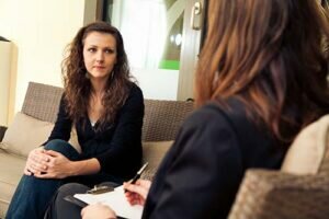 a person talks to a therapist during a ketamine therapy program